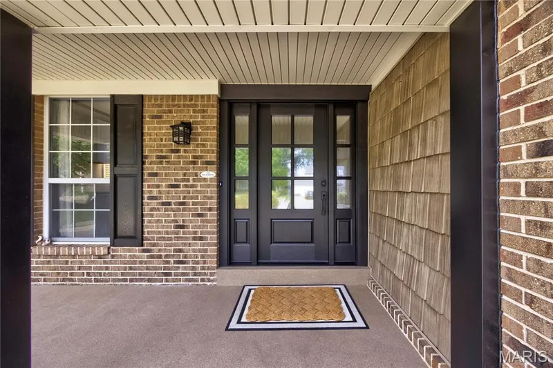 Spacious front porch with a beautiful door to welcome you inside! — 9 Carriage Way E, St Peters, MO 63376