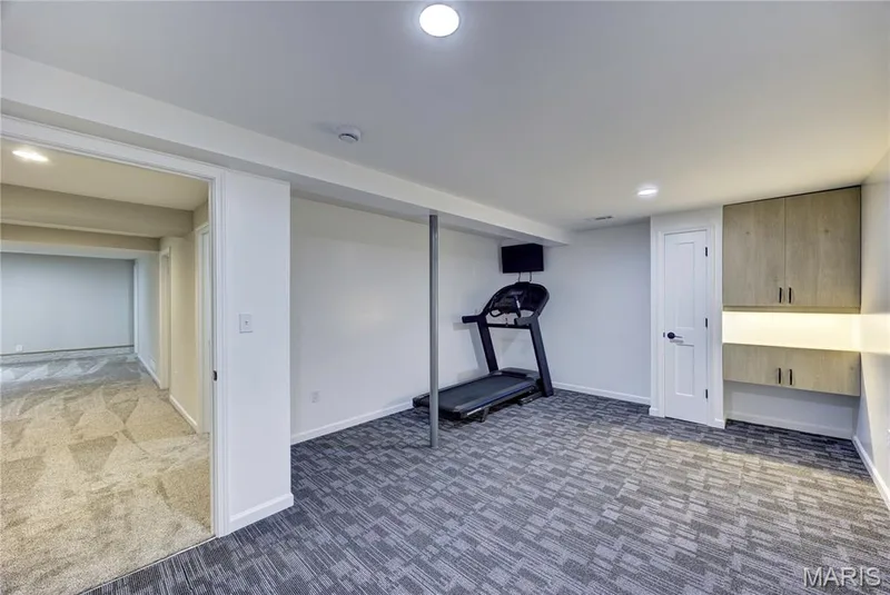 Flex room currently used as a home gym. — 9 Carriage Way E, St Peters, MO 63376