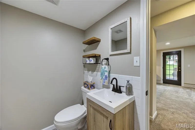Half bath in the basement. — 9 Carriage Way E, St Peters, MO 63376