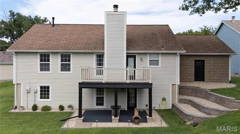 Great outdoor space to entertain! You won't get rained on while standing underneath the deck. — 9 Carriage Way E, St Peters, MO 63376