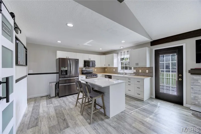 Beautiful updated kitchen with quartz countertops. — 9 Carriage Way E, St Peters, MO 63376