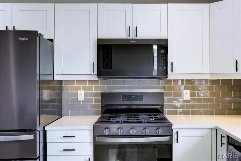 Black stainless steel Whirlpool appliances. — 9 Carriage Way E, St Peters, MO 63376