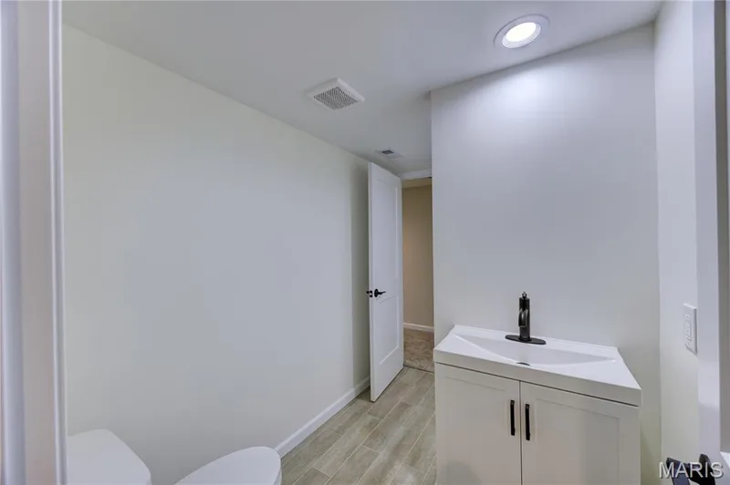 Full bath in basement. Mirror will be installed above the sink prior to closing. — 9 Carriage Way E, St Peters, MO 63376