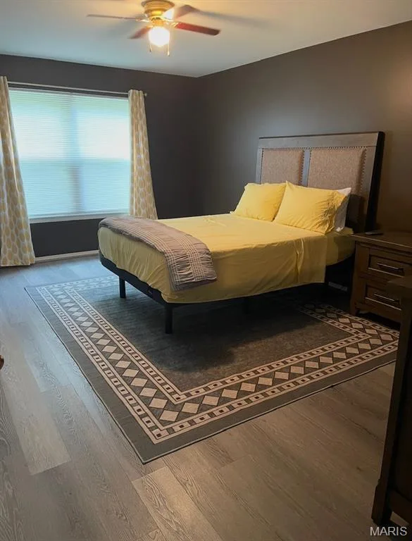 Primary bedroom has a view of the secluded  rear yard. — 1040 Sugar Creek Court #4, St Peters, MO 63376
