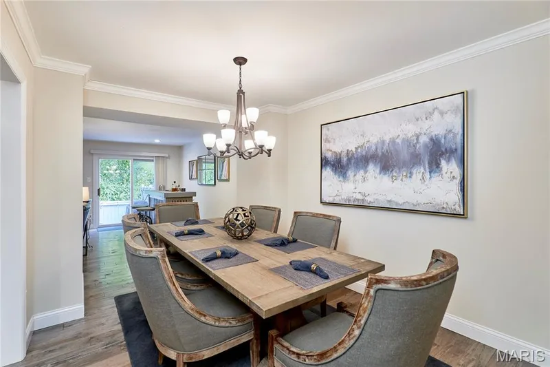 Dining leads to living room with free standing bar — 16463 Cobbleskille Drive, Chesterfield, MO 63017