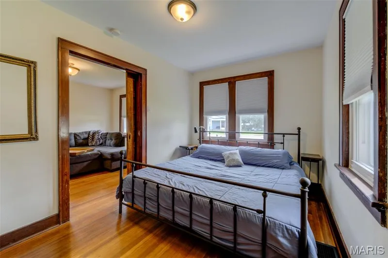 The main floor bedroom.  Beautiful historic trim throughout the home. — 2009 N 3rd Street, St Charles, MO 63301