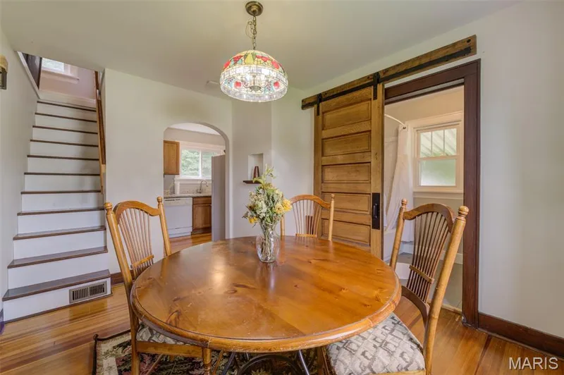 The kitchen and upstairs bedroom are also accessed from the dining room. — 2009 N 3rd Street, St Charles, MO 63301