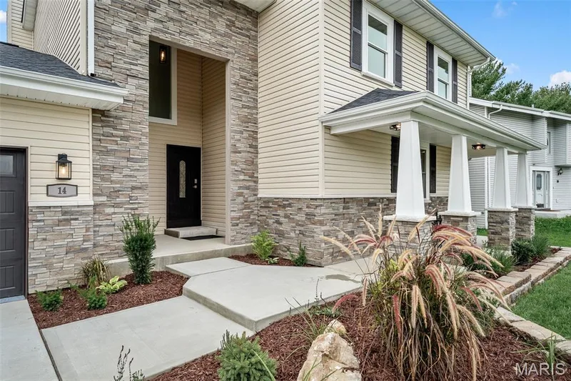Beautiful stone facade and charming front porch. — 14 Bayside Court, Lake St. Louis, MO 63367