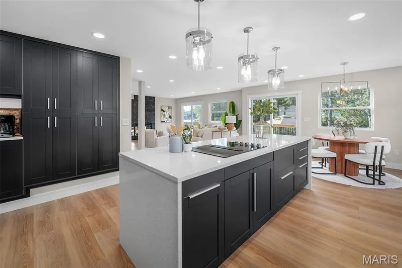 Plenty of storage on the island. The deep, dark navy contrast is so fresh! — 14 Bayside Court, Lake St. Louis, MO 63367