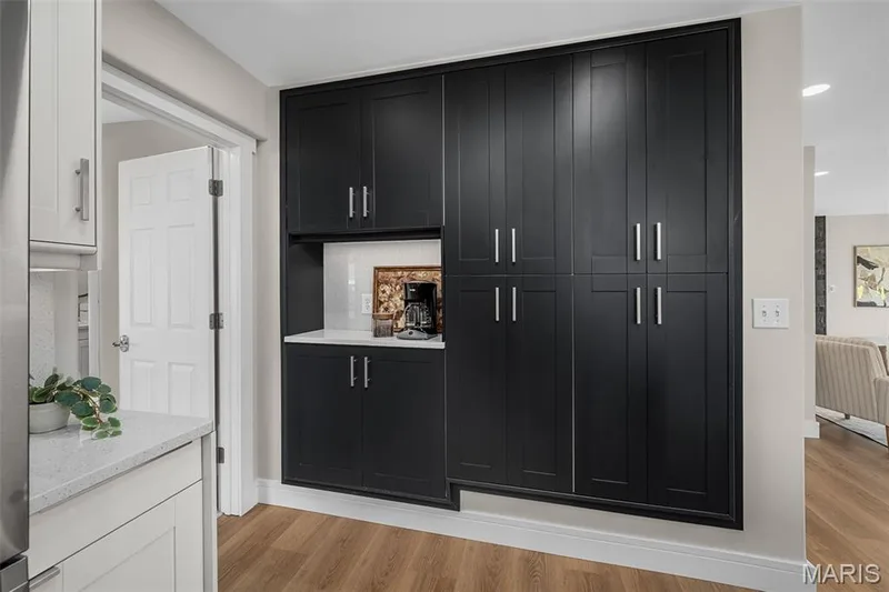 The built-in pantry will help keep everything so organized. And a coffee bar, too! — 14 Bayside Court, Lake St. Louis, MO 63367