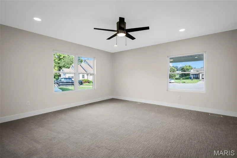 Main floor also features a spacious bedroom or office. — 14 Bayside Court, Lake St. Louis, MO 63367
