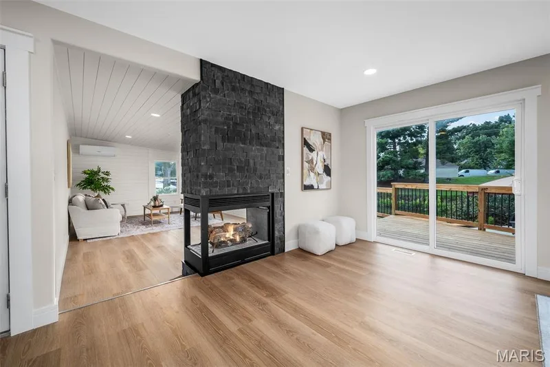 Double-sided gas fireplace and deck access. — 14 Bayside Court, Lake St. Louis, MO 63367