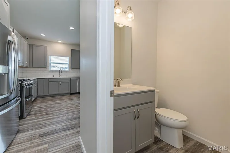 Powder Room is located off the Kitchen — 812 Colony Ridge Court, Foristell, MO 63348
