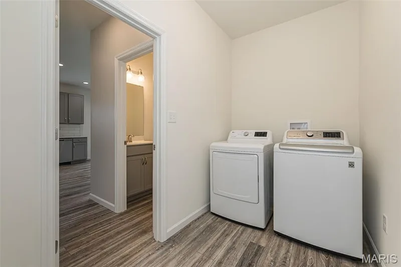 Main Floor Laundry Room located off the garage entrance — 812 Colony Ridge Court, Foristell, MO 63348