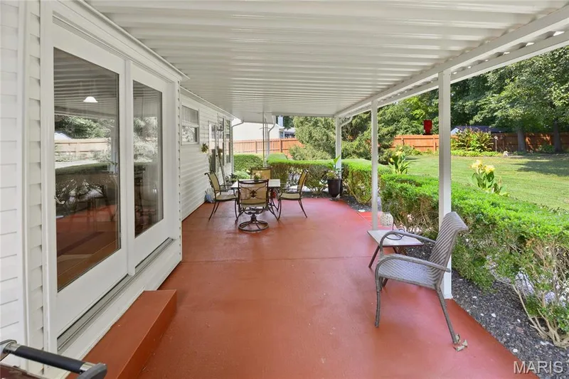 Covered patio with a painted concrete surface — 38 Fawn Valley Circle, St Peters, MO 63376