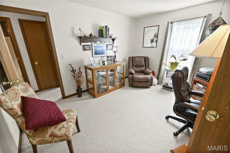 Carpeted interior space with a window featuring sheer coverings — 38 Fawn Valley Circle, St Peters, MO 63376