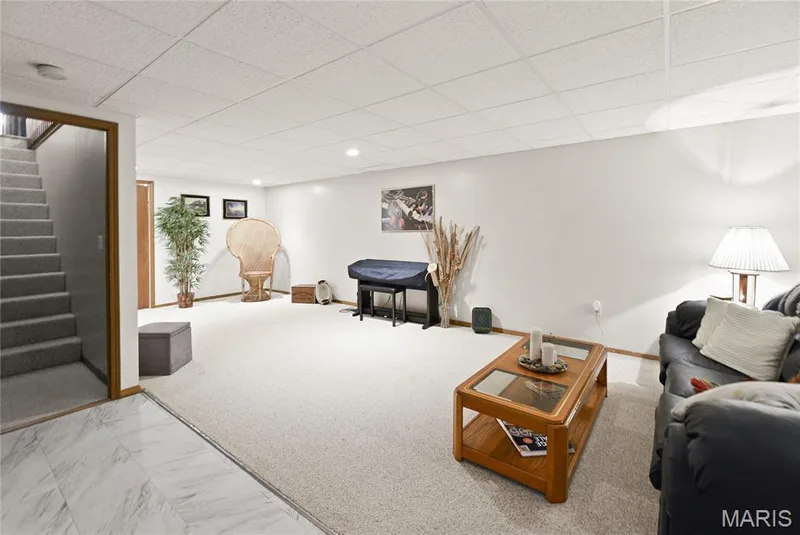 Carpeted flooring, recessed lighting, drop ceiling, white walls, wood-finish door frames — 38 Fawn Valley Circle, St Peters, MO 63376