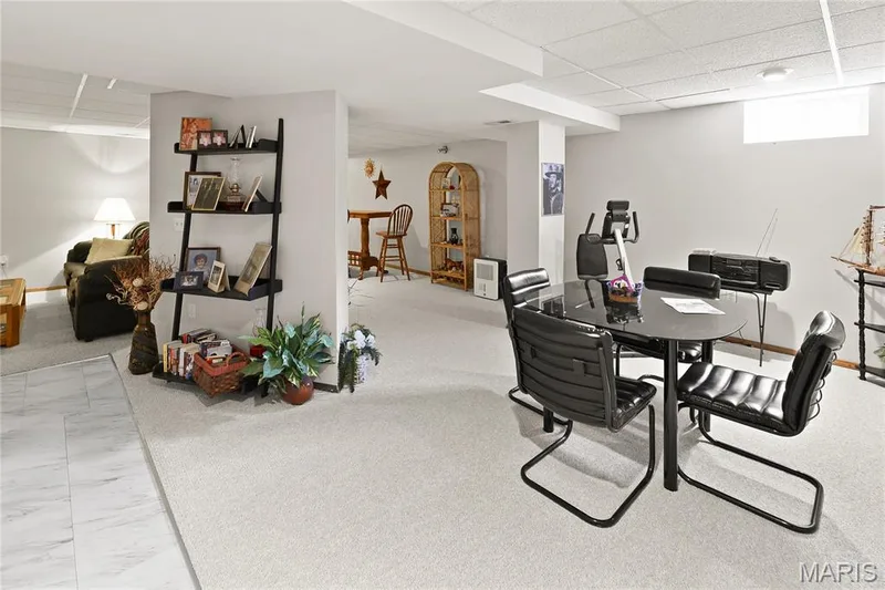 Recessed lighting, drop ceiling, and carpeted flooring in a finished lower level space — 38 Fawn Valley Circle, St Peters, MO 63376