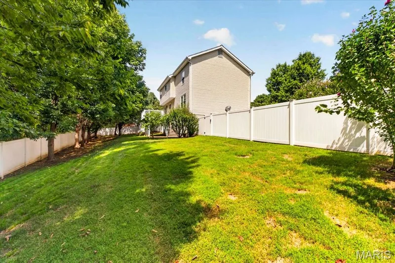 Expansive grassy yard with a full privacy fence — 53 Lions Head Court, O'Fallon, MO 63368