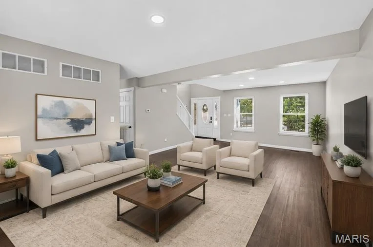 Recessed lighting, wood-finish flooring, multiple windows, and white trim throughout — 53 Lions Head Court, O'Fallon, MO 63368