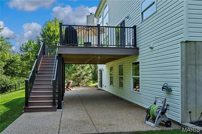 Patio extends across the back of home — 611 Knollshire Way, Dardenne Prairie, MO 63368