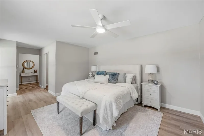 Conveniently located off the foyer, the main level primary suite features an en suite bath and washer and dryer hookups. — 3034 Willow Wood Drive, St Charles, MO 63303