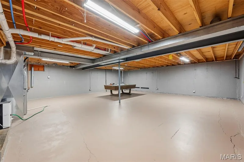 The unfinished lower level offers flexible space for a future rec room, entertaining, or additional storage. — 3034 Willow Wood Drive, St Charles, MO 63303