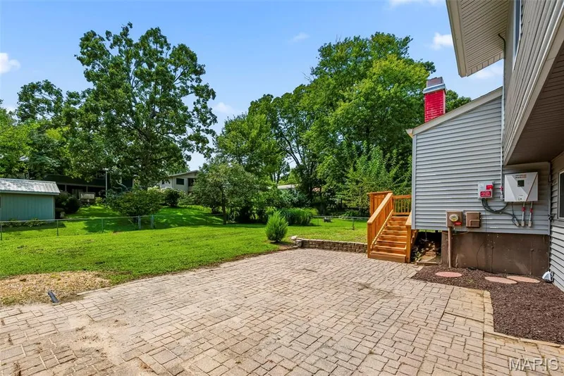 Expansive paver patio provides ample additional outdoor space for entertaining and relaxing. — 3034 Willow Wood Drive, St Charles, MO 63303