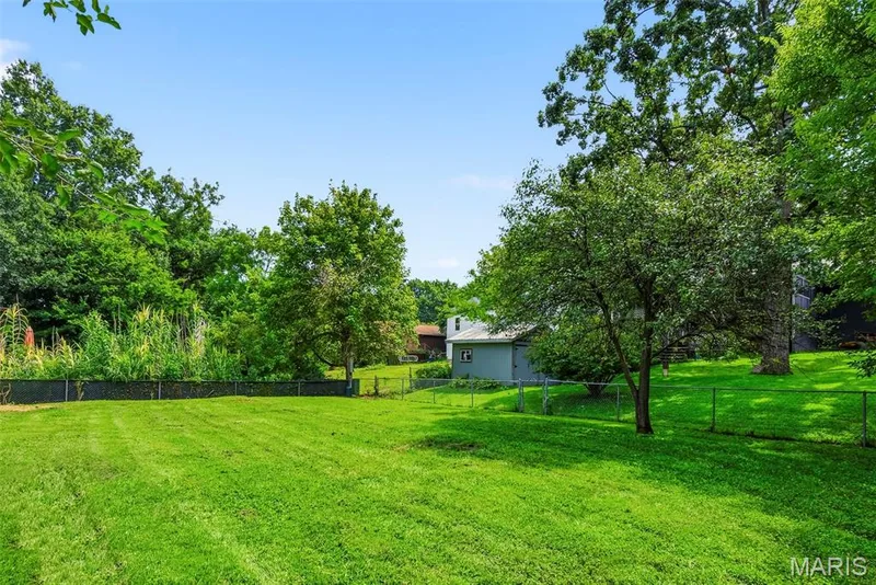 Large, level fenced backyard offers plenty of space for relaxing, outdoor activities and entertaining. — 3034 Willow Wood Drive, St Charles, MO 63303