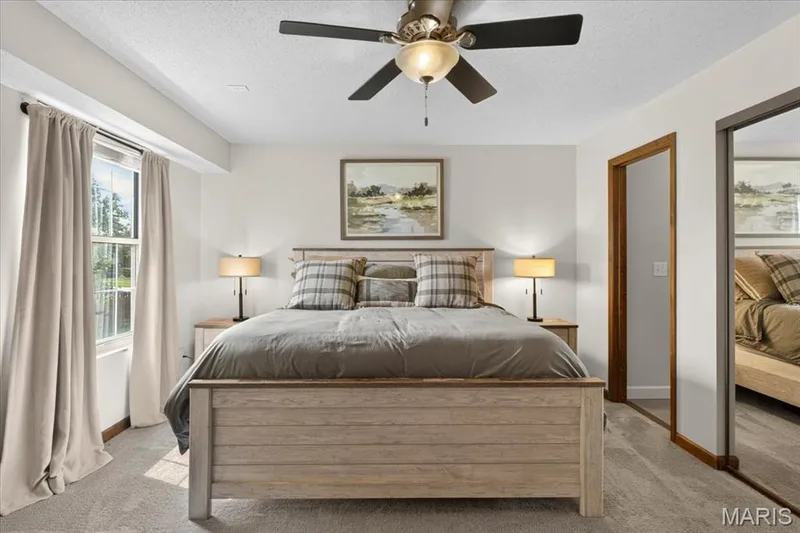 Neutral-toned walls complement the window with natural light — 1383 Forest Creek Drive #5, St Charles, MO 63303