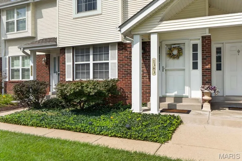 Brick and siding exterior with white window shutters — 1383 Forest Creek Drive #5, St Charles, MO 63303