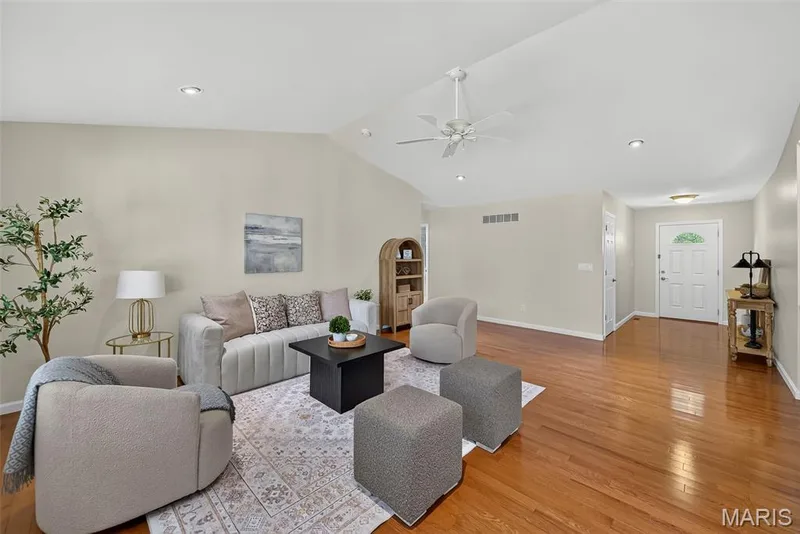 Vaulted living room with recess lighting and hardwood flooring. — 1761 Fairview Farms Circle, Wentzville, MO 63385