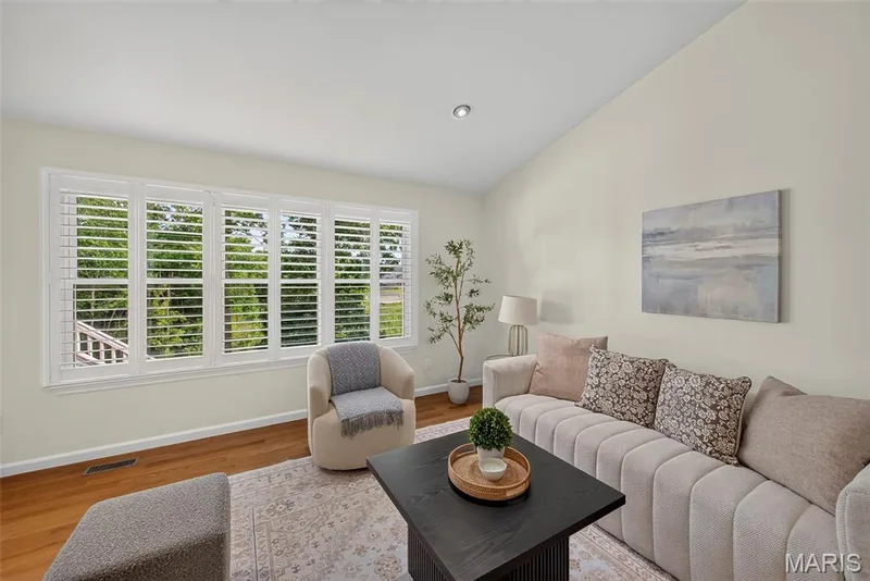 Plantation shutters to compliment the vaulted living room. — 1761 Fairview Farms Circle, Wentzville, MO 63385