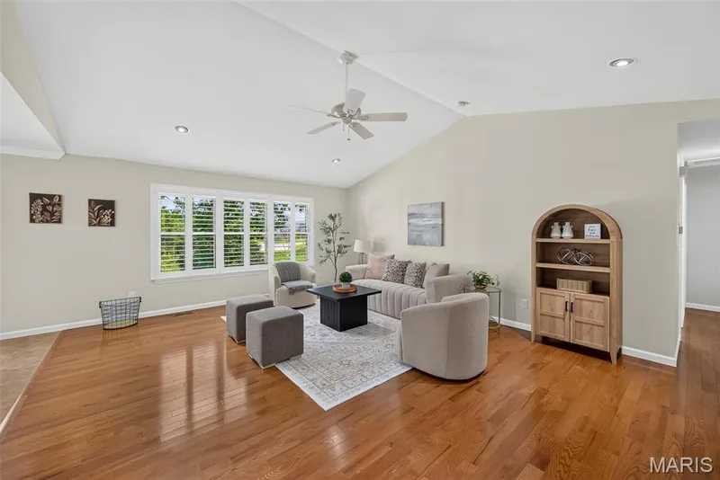 Beautiful hardwood flooring, decorative ceiling fan, recess lighting all compliment the living room. — 1761 Fairview Farms Circle, Wentzville, MO 63385