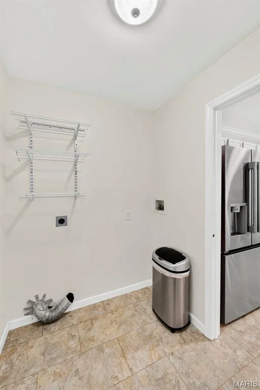 Main floor laundry room with full closet in same room. — 1761 Fairview Farms Circle, Wentzville, MO 63385