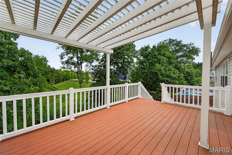 Large composite deck with pergola and walks down to the patio. — 1761 Fairview Farms Circle, Wentzville, MO 63385