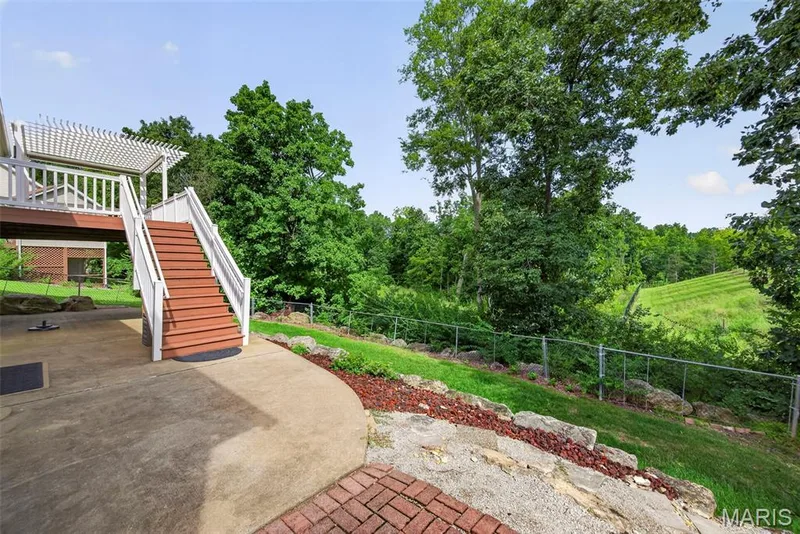 Decks walks down to large patio area. — 1761 Fairview Farms Circle, Wentzville, MO 63385