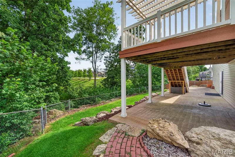 Decorative landscaping, rock and stone ledging and fenced yard. — 1761 Fairview Farms Circle, Wentzville, MO 63385