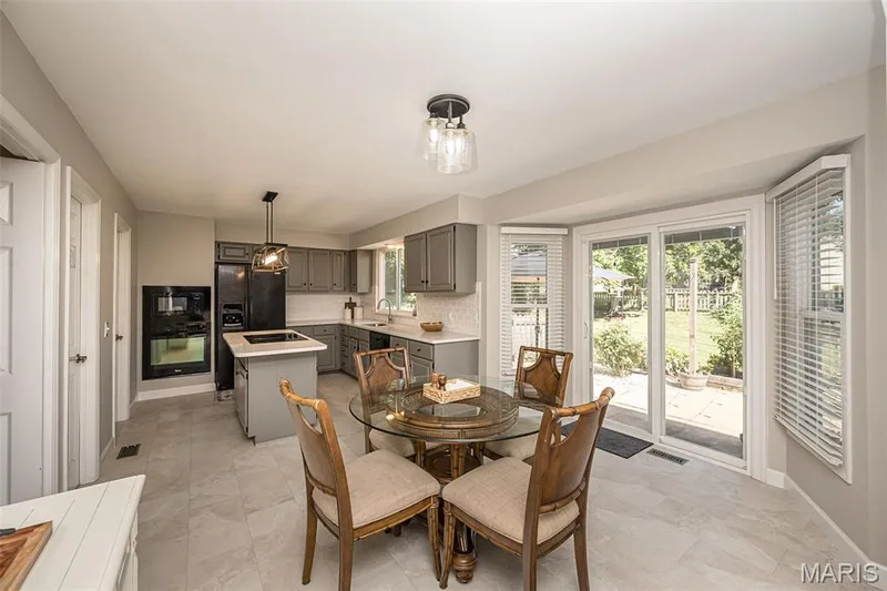 Updated Breakfast room/kitchen area with newer sliding door — 15706 Heathercroft Drive, Chesterfield, MO 63017
