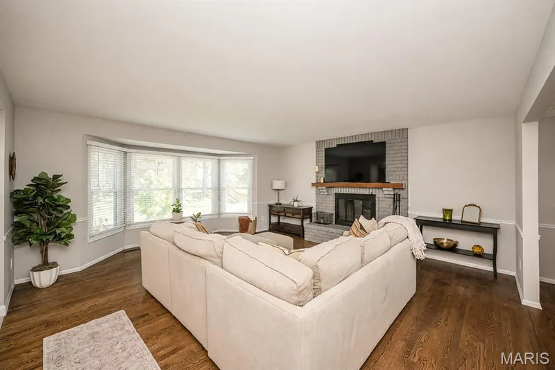 Family room with bay window and wood burning fireplace — 15706 Heathercroft Drive, Chesterfield, MO 63017