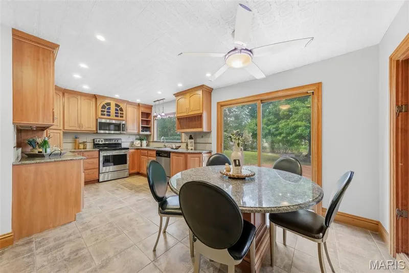 Beautiful custom kitchen with solid wood cabinets, solid wood millwork, stainless appliances and granite countertops. — 1028 Monfort Court, Lake St. Louis, MO 63367