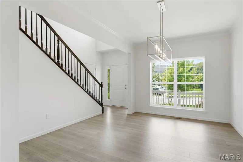 Light filled dining room with crown molding and wood floors — 1278 Harvester Drive, Chesterfield, MO 63005