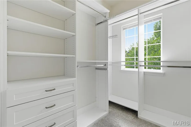 Large primary closet with custom closet system and large window — 1278 Harvester Drive, Chesterfield, MO 63005