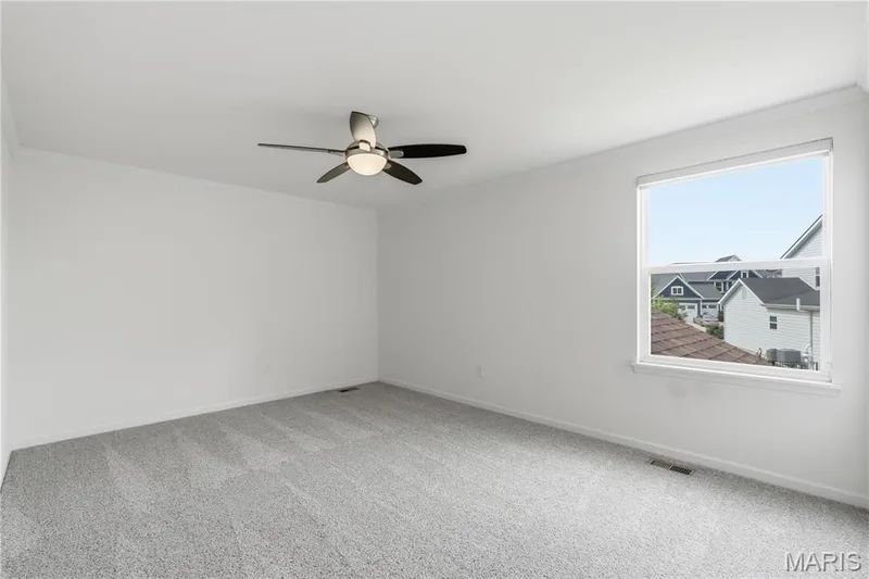 Third upstairs bedroom with crown molding, ceiling fan, and closet with custom closet system — 1278 Harvester Drive, Chesterfield, MO 63005