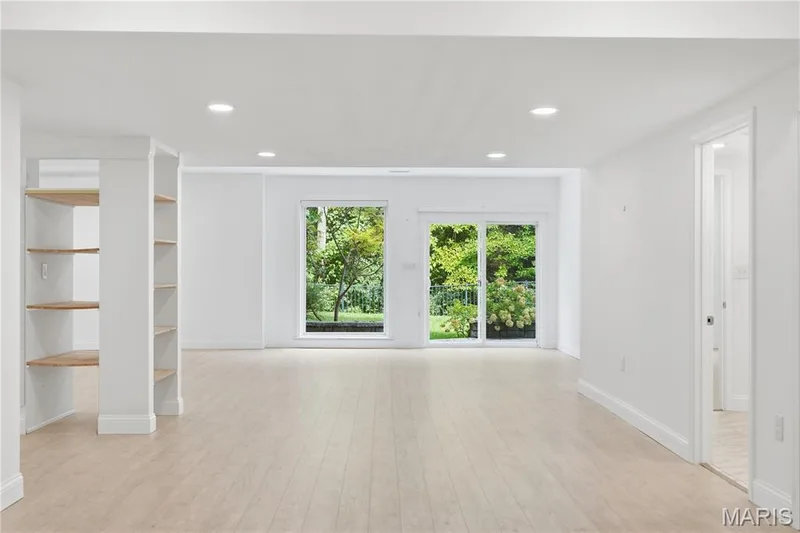 Large recreation room in the beautifully finished walk out lower level. Lots or light and door leading to the flagstone patio area. The lower level adds approximately 1,400 square feet of addition exceptional living — 1278 Harvester Drive, Chesterfield, MO 63005