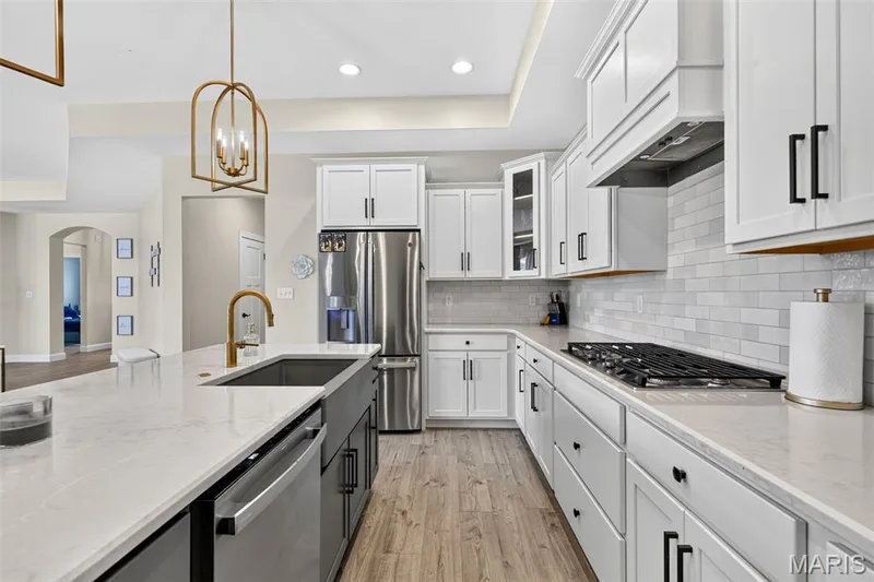 Open kitchen with wall oven and custom cabinets — 155 Haven Ridge Court, Dardenne Prairie, MO 63368