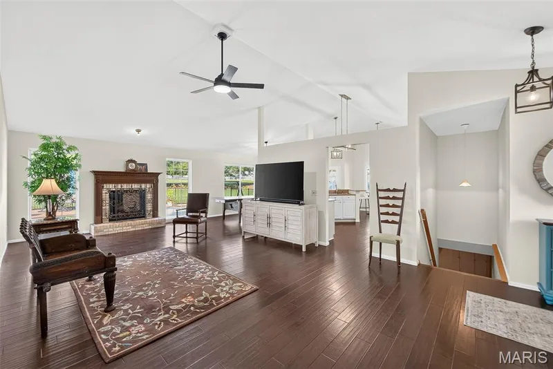 Vaulted living room with fireplace — 1509 Langrove Drive, O'Fallon, MO 63368