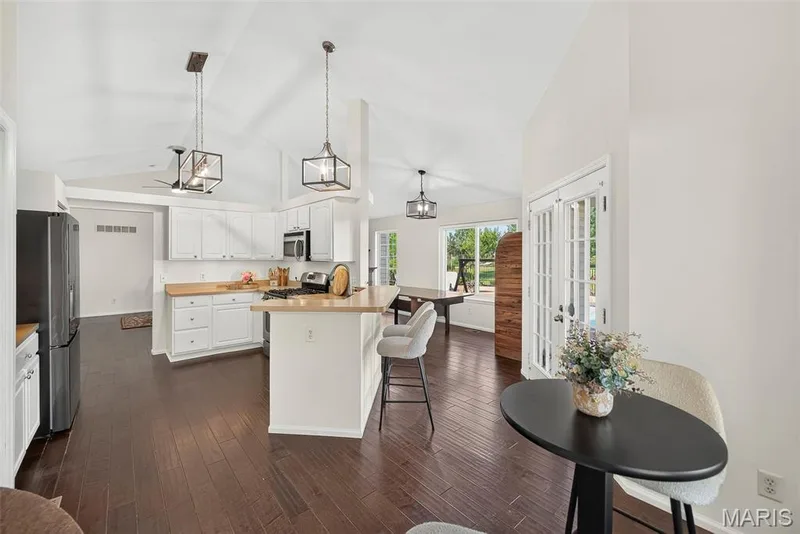 Transition from the breakfast nook to the kitchen — 1509 Langrove Drive, O'Fallon, MO 63368