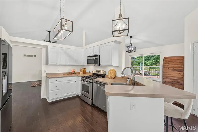Kitchen with white cabinets — 1509 Langrove Drive, O'Fallon, MO 63368