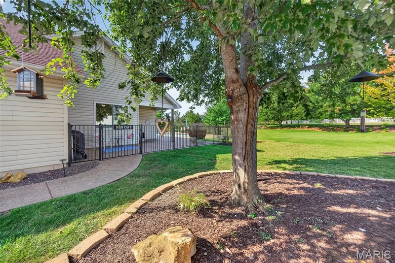 Mature trees and gate to side yard — 1509 Langrove Drive, O'Fallon, MO 63368